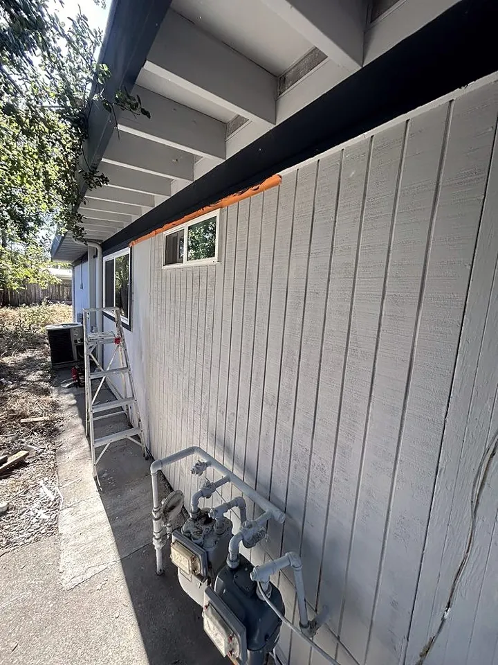 New siding and trim on the side of a house