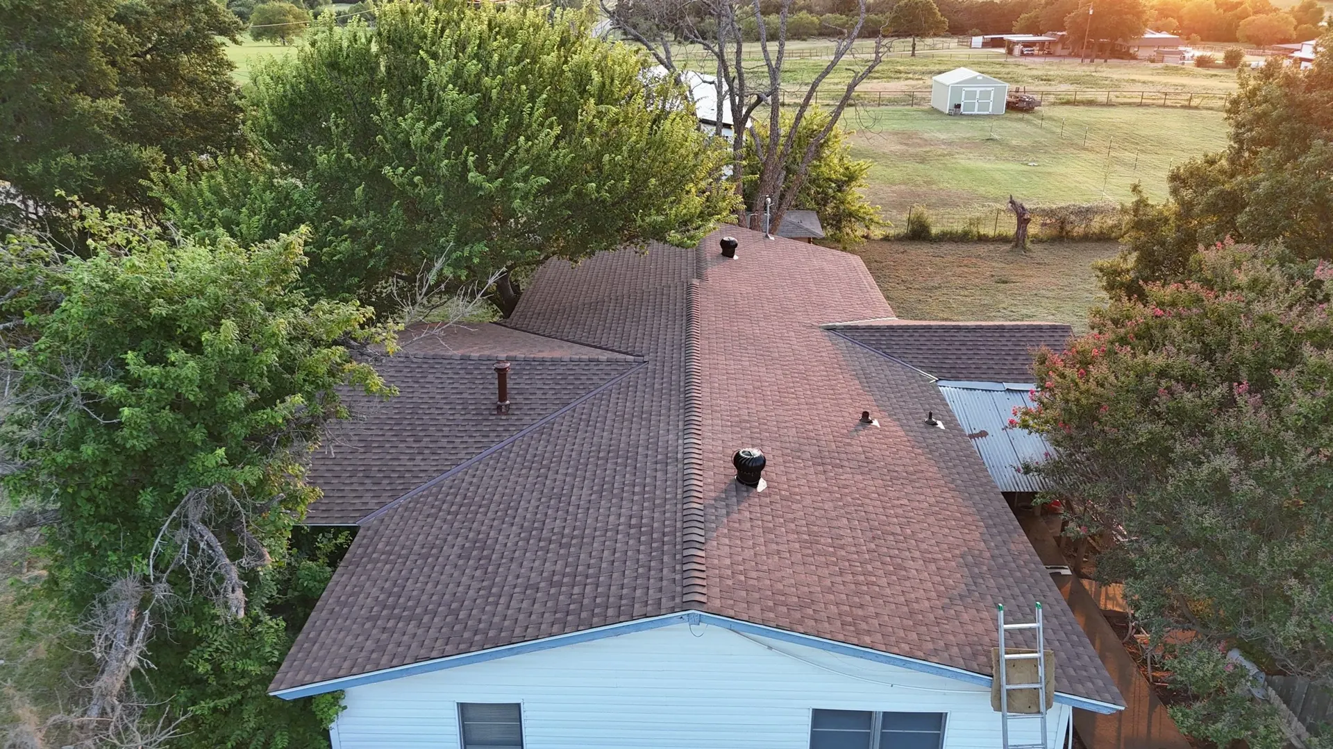 Aerial view of a finished shingle roof replacement
