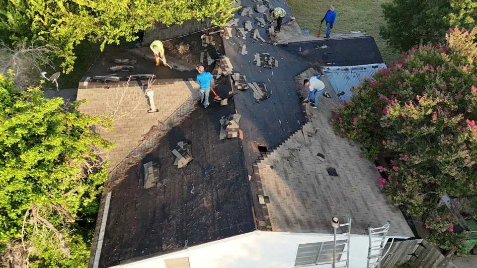 Crew replacing a storm-damaged roof